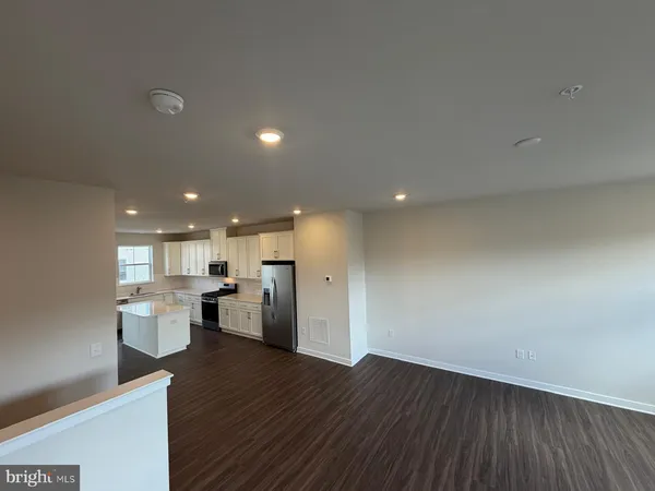 a view of kitchen with wooden floor