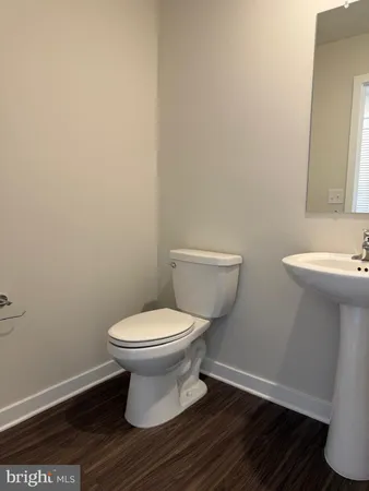 a bathroom with a toilet and a sink