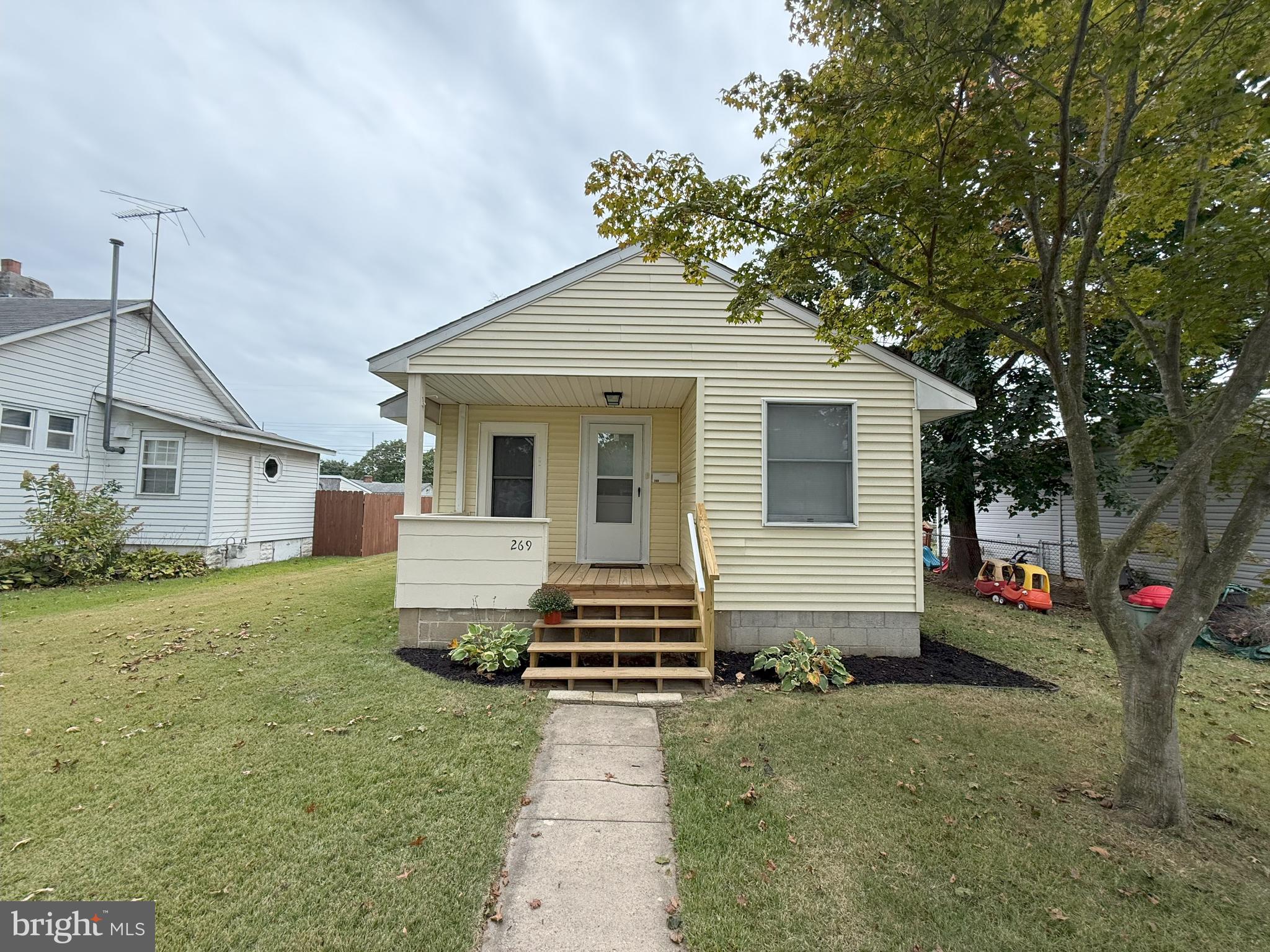269 B Street Carneys Point, NJ 08069 - Photo 2 of 17 a front view of a house with a yard and garage