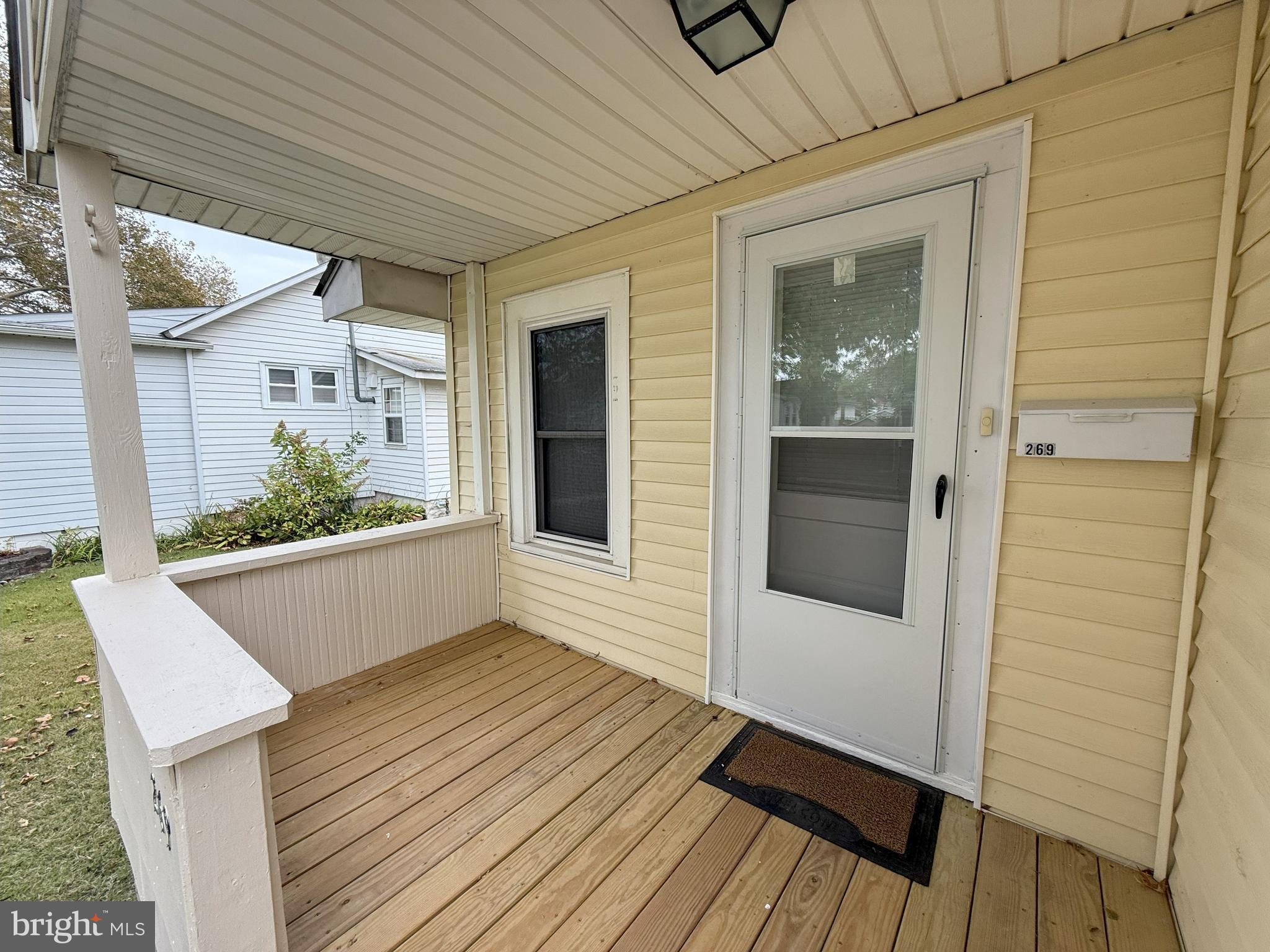 269 B Street Carneys Point, NJ 08069 - Photo 3 of 17 a view of balcony with wooden floor and potted plant