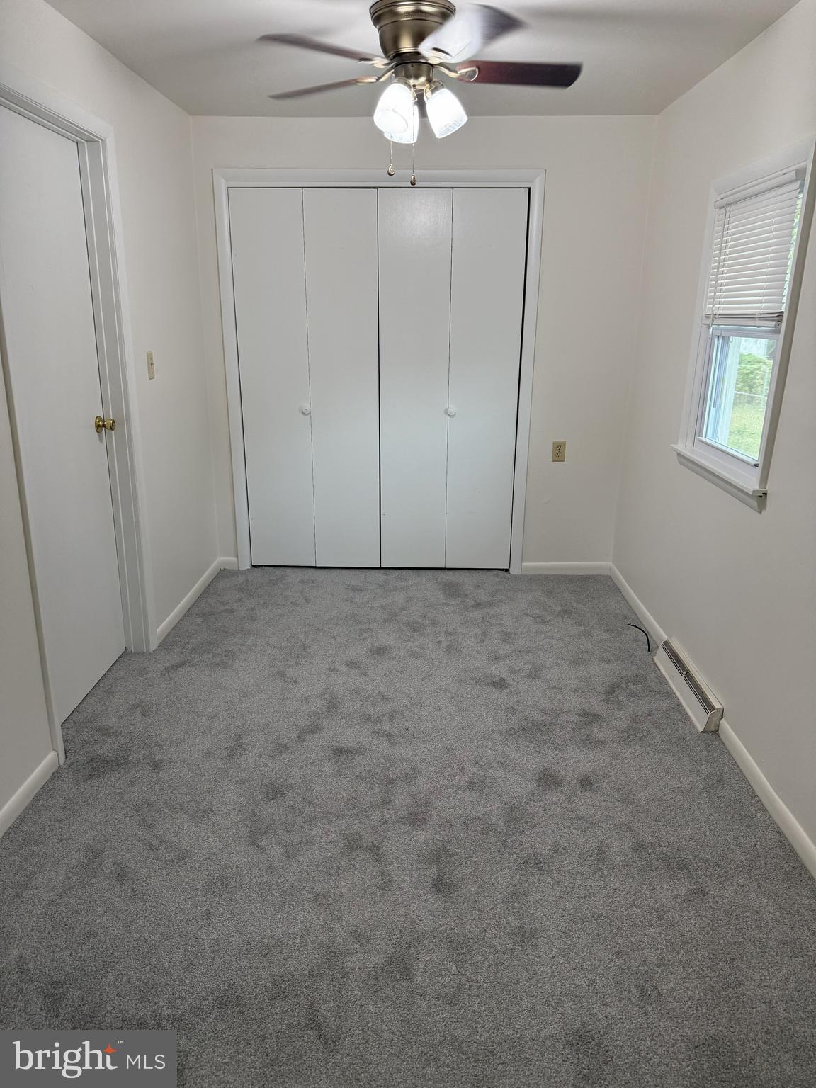 269 B Street Carneys Point, NJ 08069 - Photo 9 of 17 en empty room with fan and window