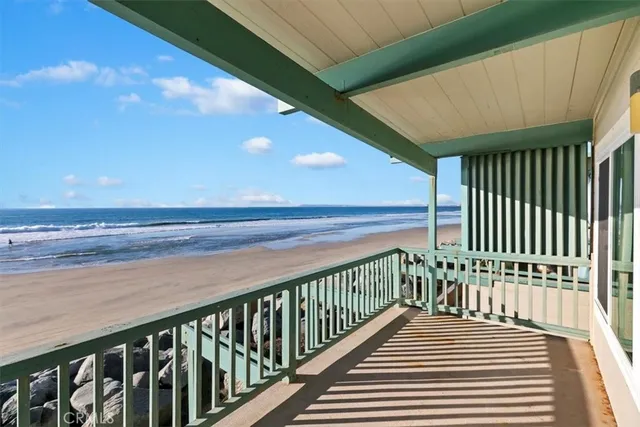 a view of a balcony with wooden floor
