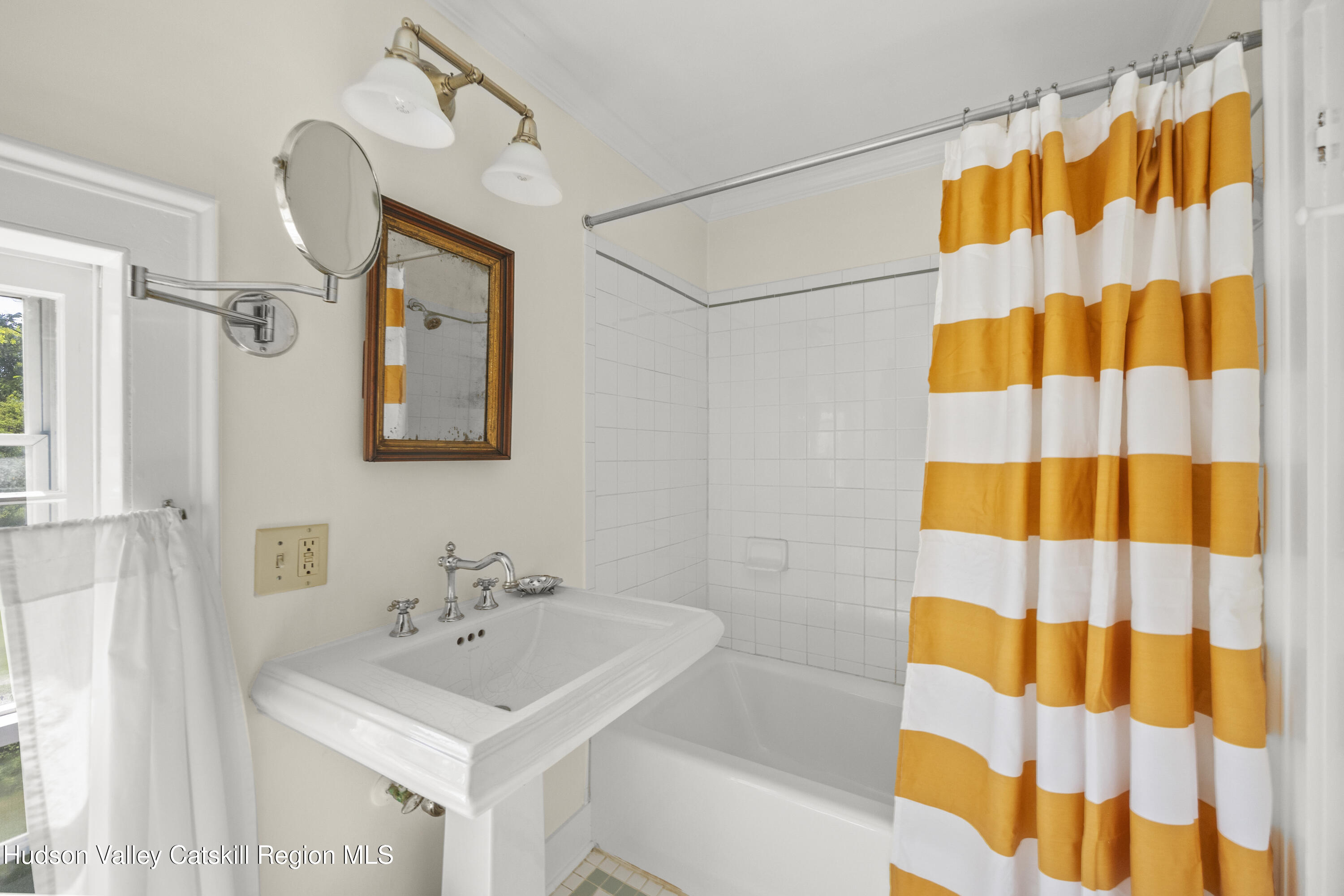 11549 Highway 22 Austerlitz, NY 12017 - Photo 19 of 28 a bathroom with a sink a mirror and a shower