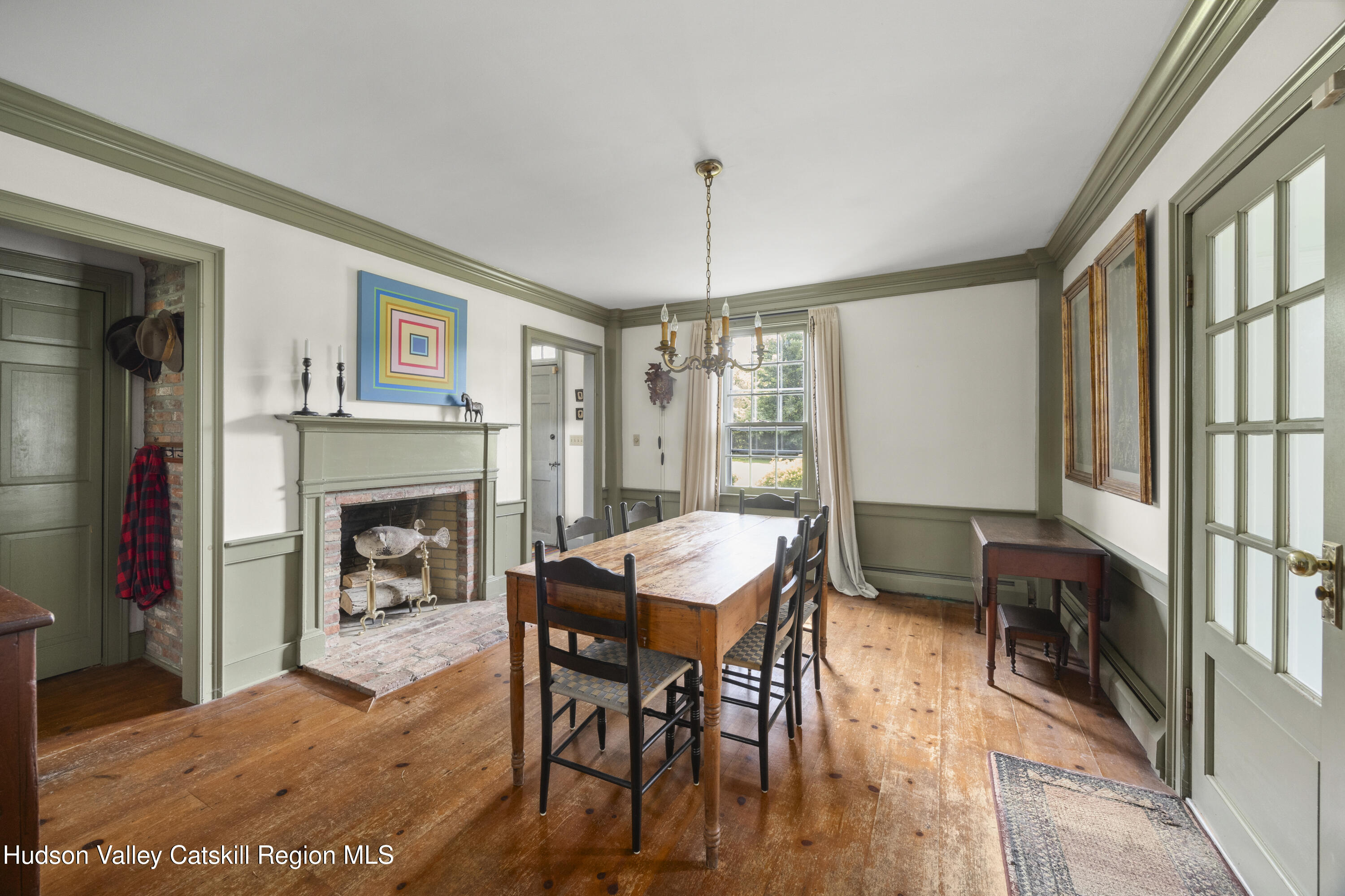 11549 Highway 22 Austerlitz, NY 12017 - Photo 5 of 28 a livingroom with fireplace dining area and a couch
