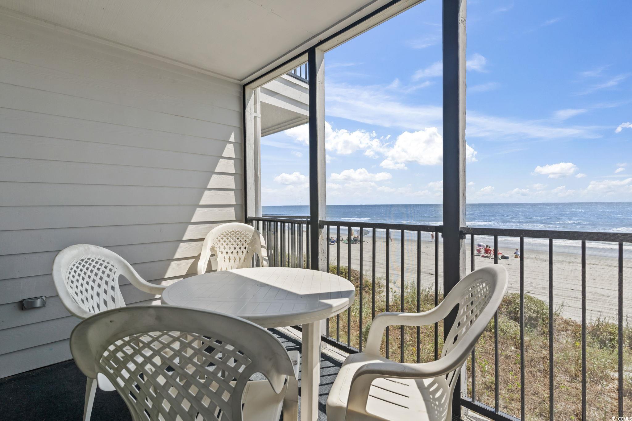 1780 North Waccamaw Drive, Unit 109 Murrells Inlet, SC 29576 - Photo 16 of 19 Balcony featuring view of water and beach
