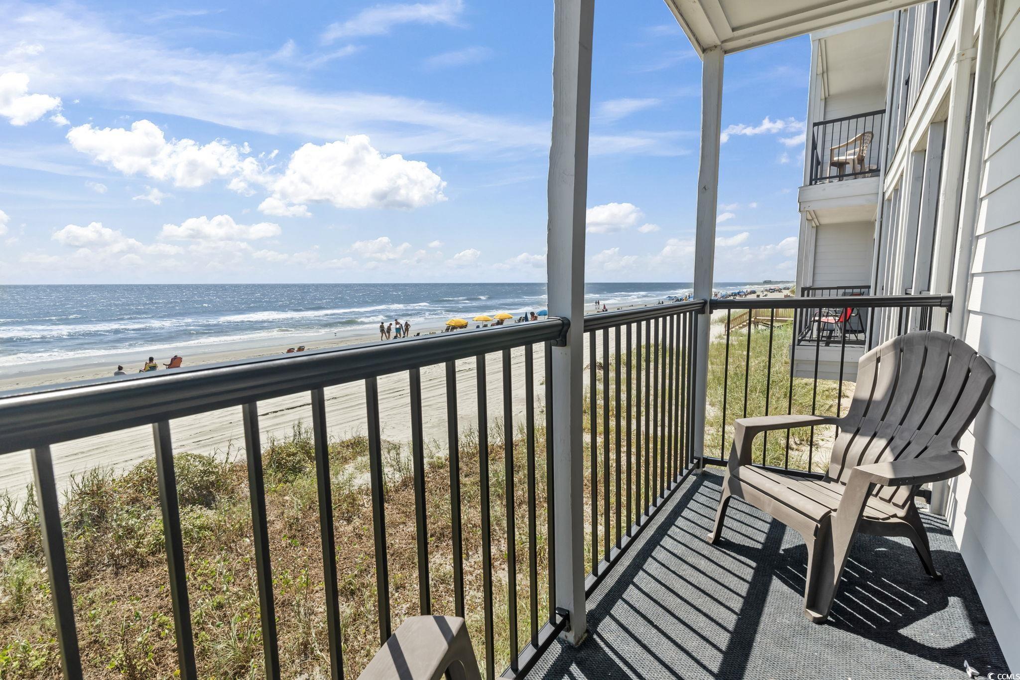 1780 North Waccamaw Drive, Unit 109 Murrells Inlet, SC 29576 - Photo 17 of 19 Balcony with view of water and beach
