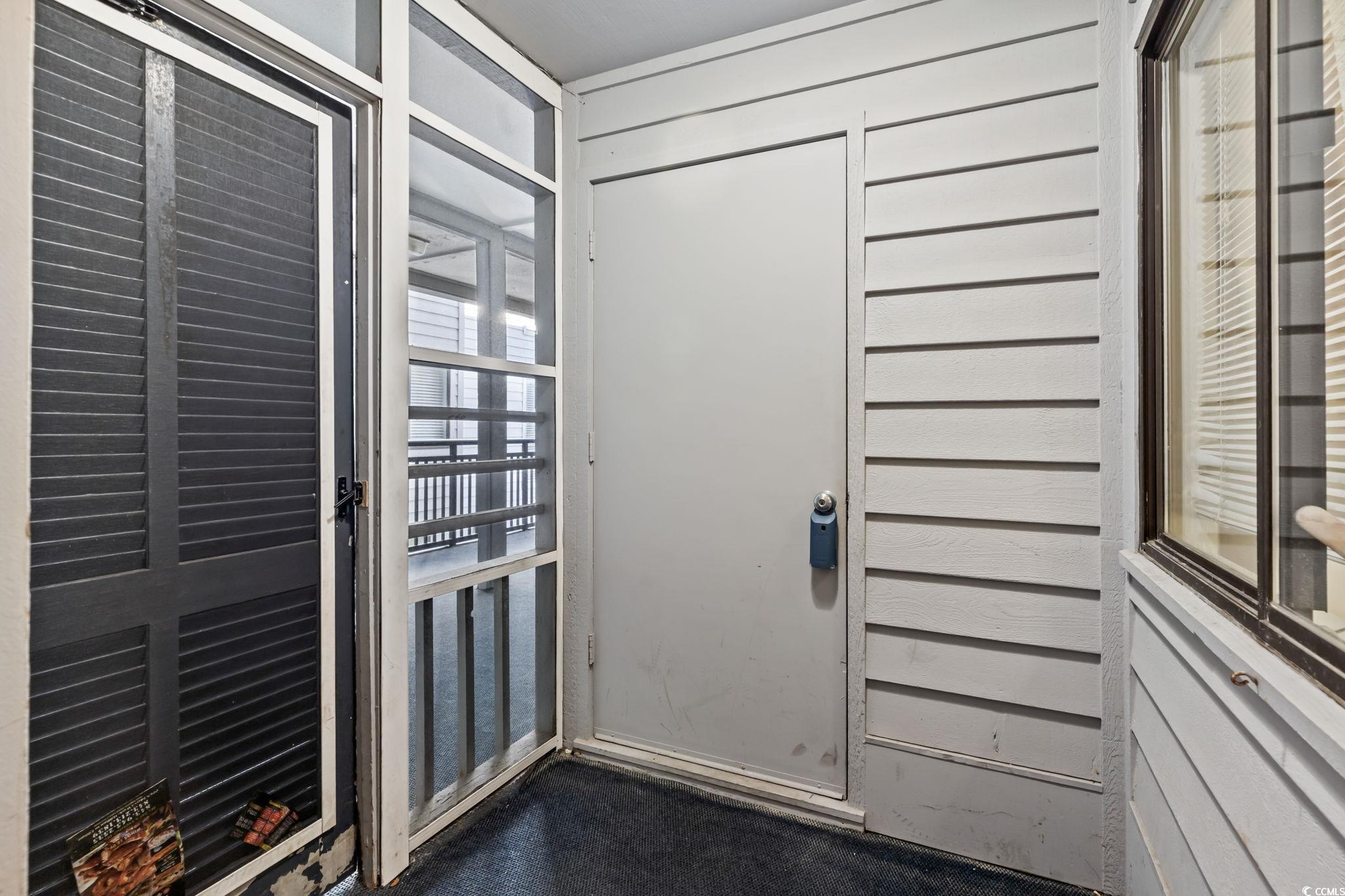 1780 North Waccamaw Drive, Unit 109 Murrells Inlet, SC 29576 - Photo 18 of 19 View of doorway to outside