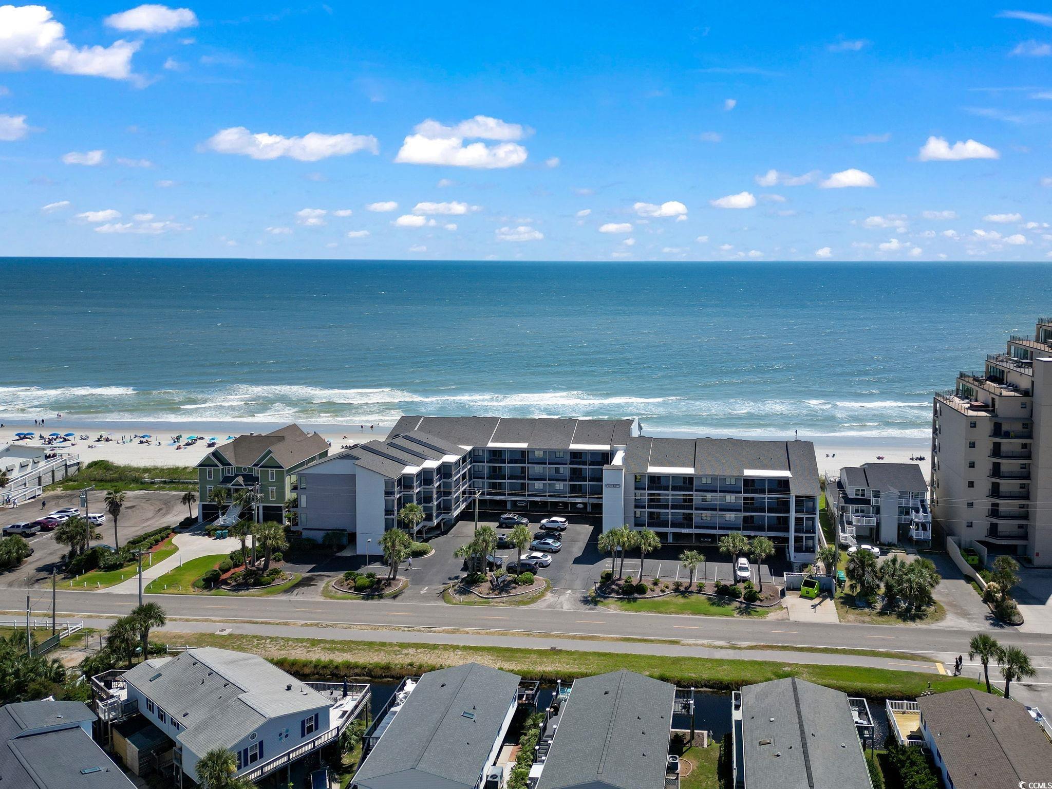 1780 North Waccamaw Drive, Unit 109 Murrells Inlet, SC 29576 - Photo 2 of 19 Aerial view of apartment complex and unending shoreline