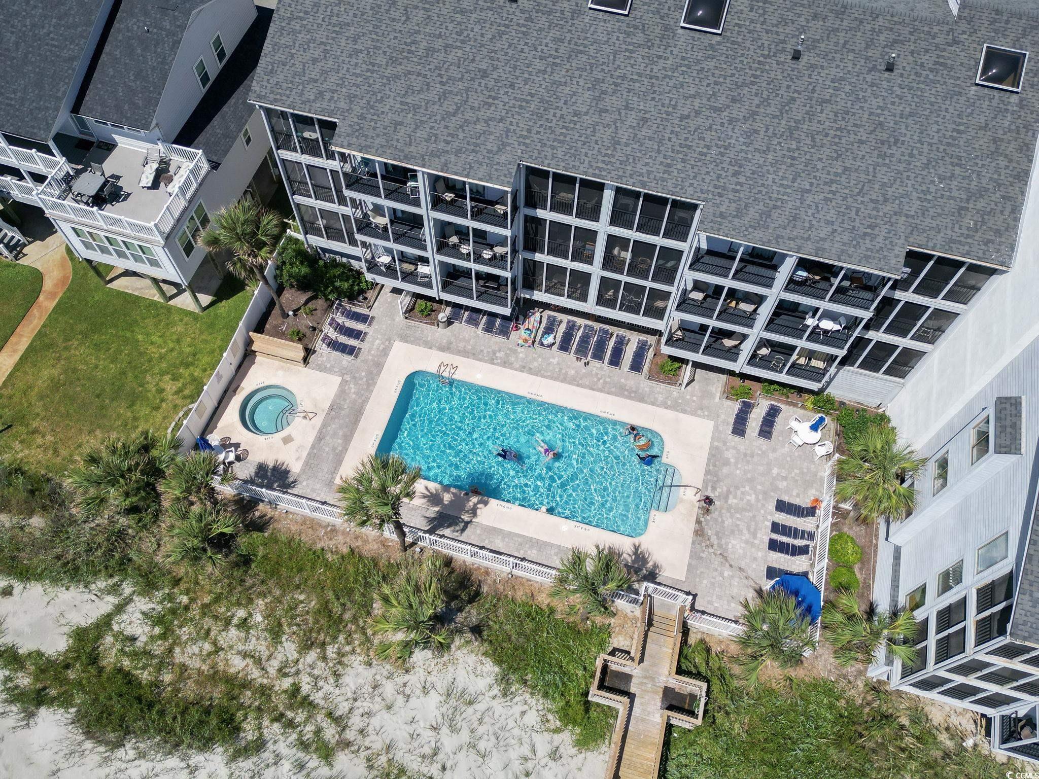 1780 North Waccamaw Drive, Unit 109 Murrells Inlet, SC 29576 - Photo 3 of 19 Drone / aerial view of a pool area