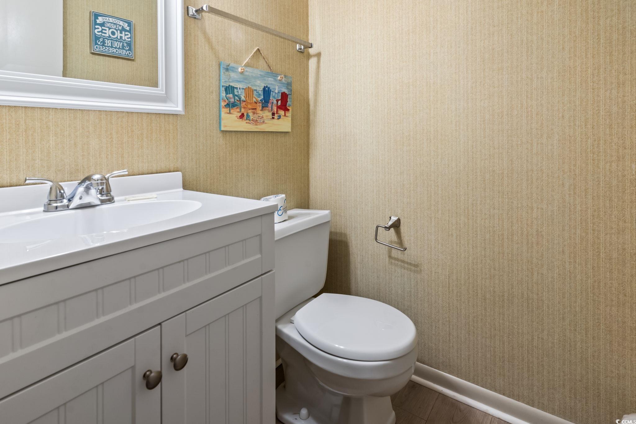 1780 North Waccamaw Drive, Unit 109 Murrells Inlet, SC 29576 - Photo 5 of 19 Bathroom with vanity and wallpapered walls