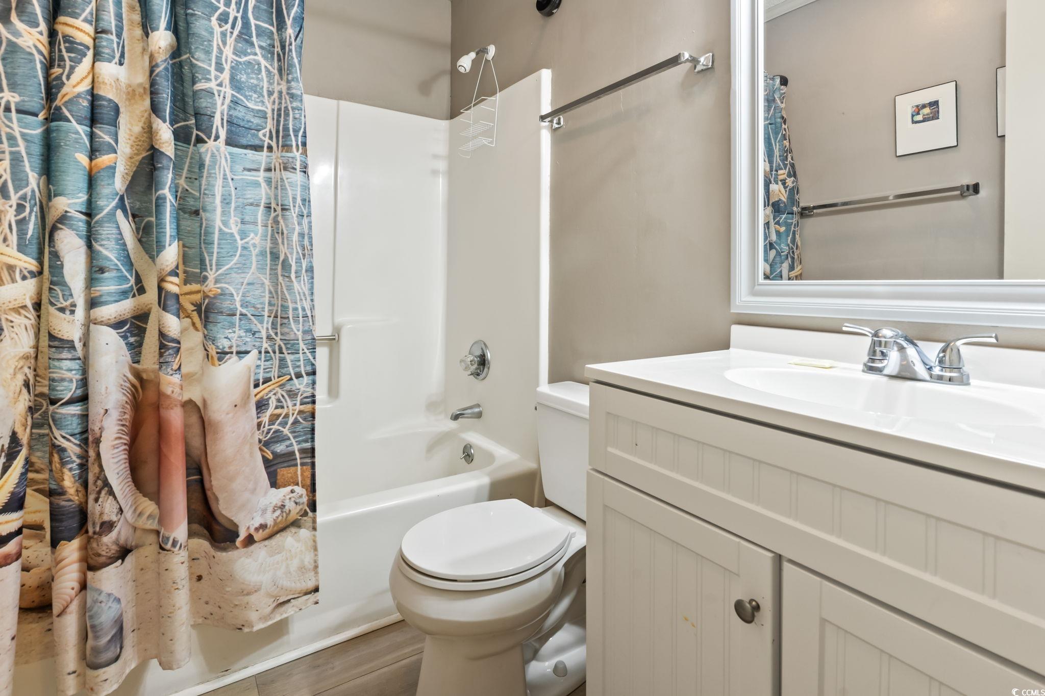 1780 North Waccamaw Drive, Unit 109 Murrells Inlet, SC 29576 - Photo 7 of 19 Full bath featuring shower / bath combo with shower curtain and vanity