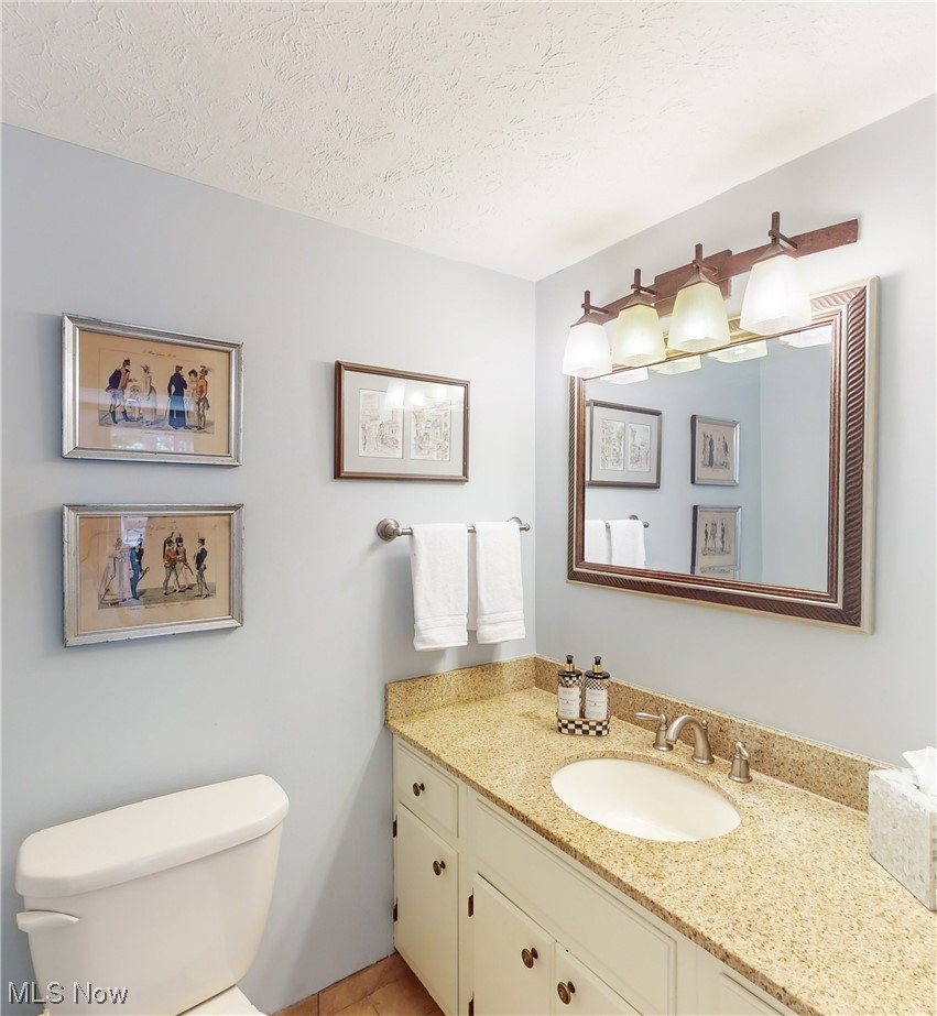 1881 Winchester Road Cleveland, OH 44124 - Photo 13 of 27 Conveniently off the foyer is the first floor half Bathroom with updated expansive cabinet space.