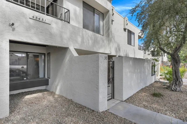 a view of a house with a tree