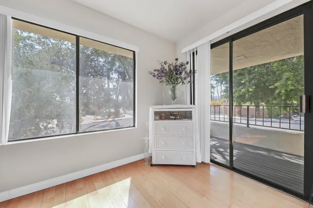 a view of empty room with floor to ceiling window