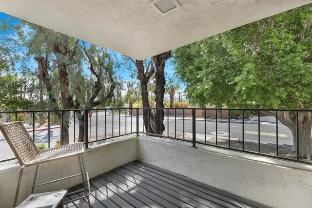 a view of balcony with wooden floor