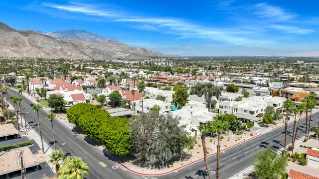 a view of a city with mountains in the background