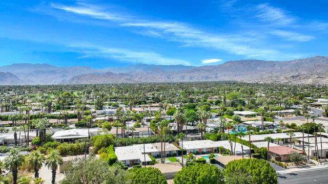 a view of a city with green space