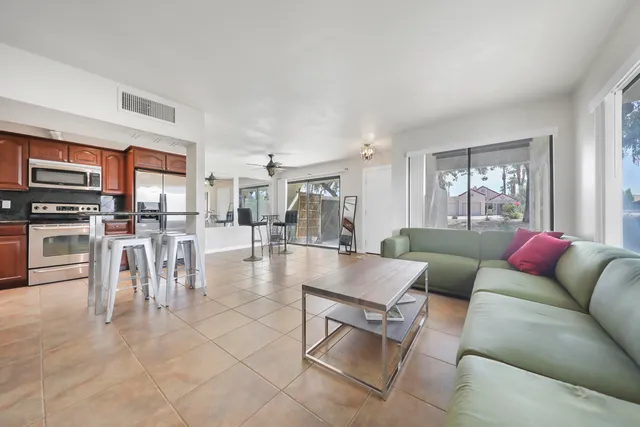 a living room with furniture and a large window