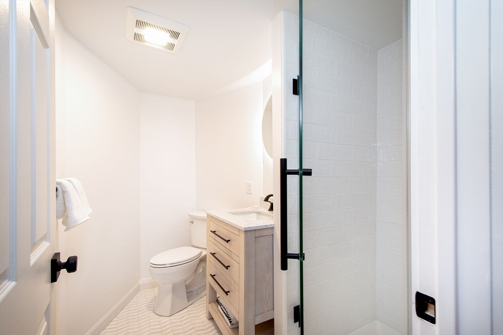 64 Cross Street Hingham, MA 02043 - Photo 13 of 23 a bathroom with a toilet and a shower