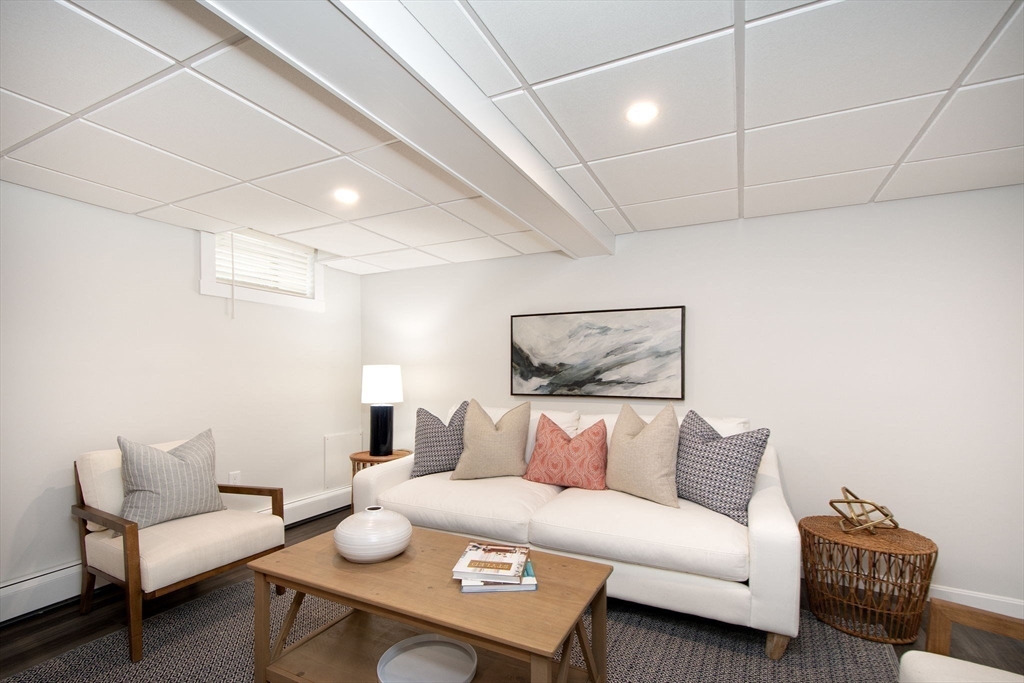 64 Cross Street Hingham, MA 02043 - Photo 14 of 23 a living room with furniture and a table