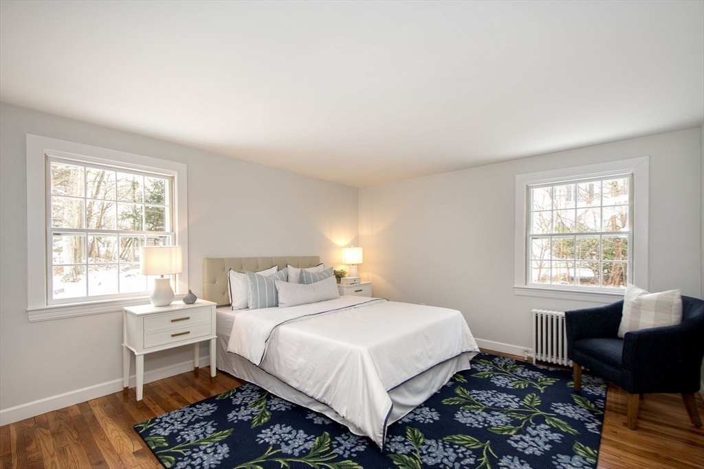 64 Cross Street Hingham, MA 02043 - Photo 16 of 23 a bedroom with a bed and a window