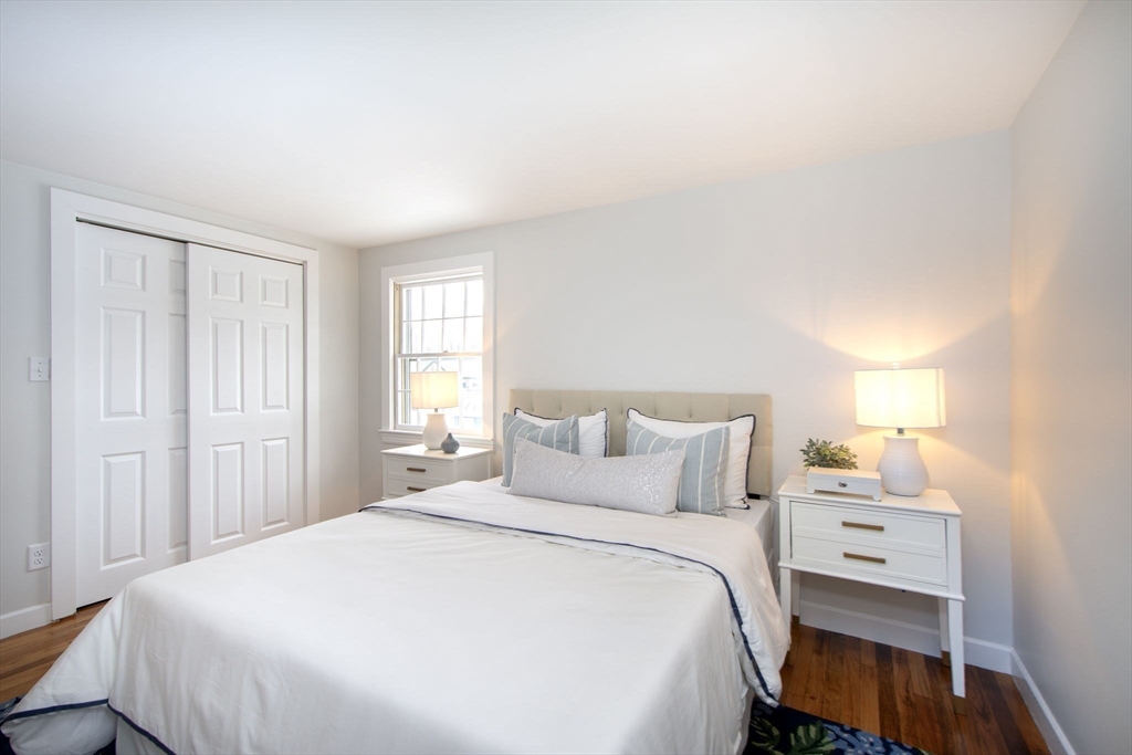 64 Cross Street Hingham, MA 02043 - Photo 19 of 23 a bedroom with a bed and a window