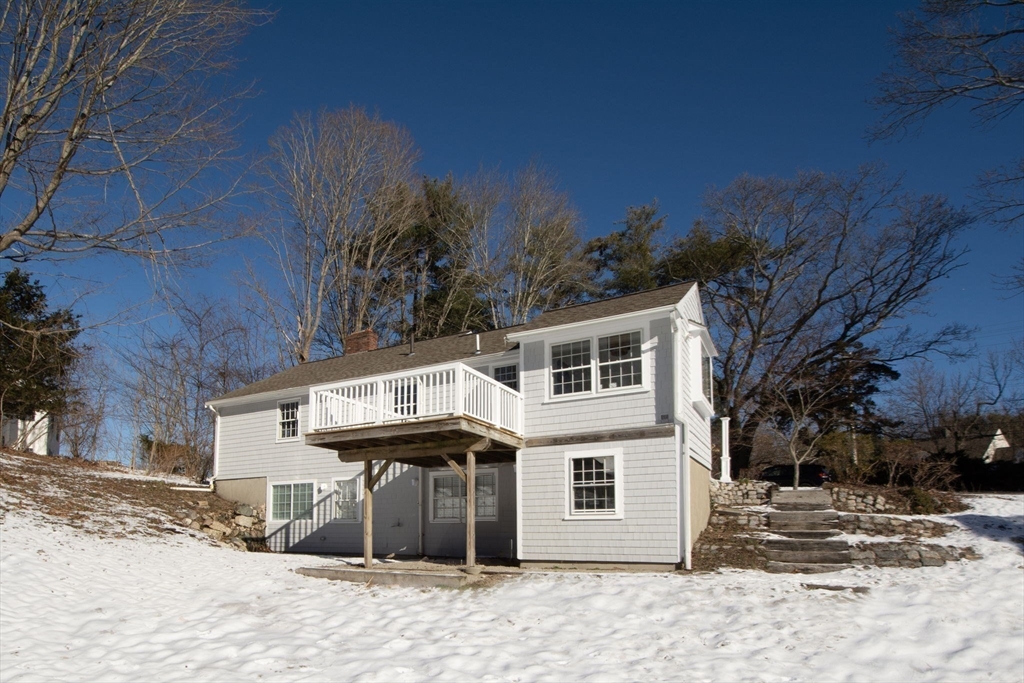 64 Cross Street Hingham, MA 02043 - Photo 21 of 23 a front view of a house with a yard