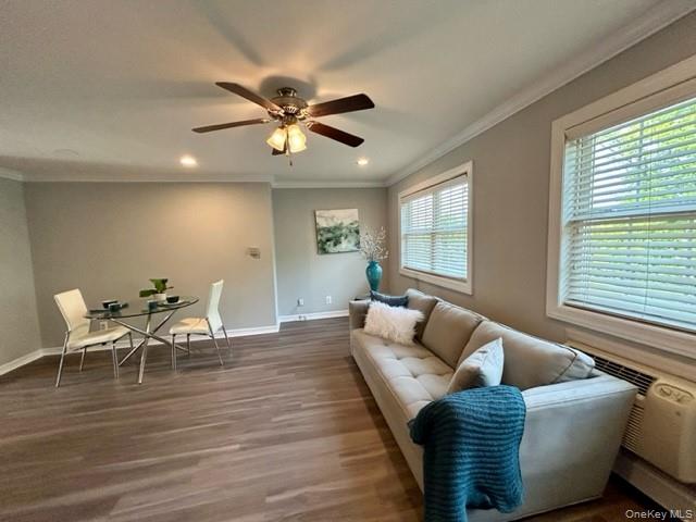 184 Hallock Road, Unit 3A2 Lake Grove, NY 11755 - Photo 4 of 7 a living room with furniture wooden floor and window