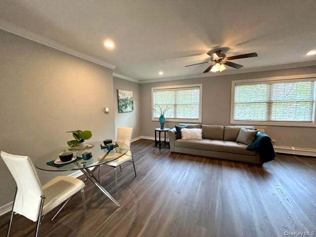 184 Hallock Road, Unit 3A2 Lake Grove, NY 11755 - Photo 5 of 7 a living room with furniture and a wooden floor