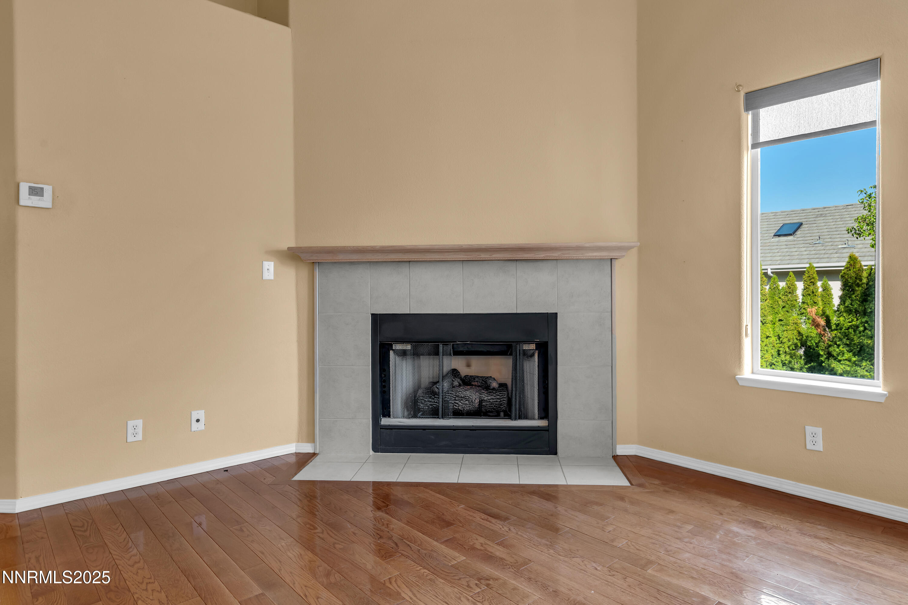 6248 Golden Meadow Road Reno, NV 89519 - Photo 12 of 64 a living room with a fireplace