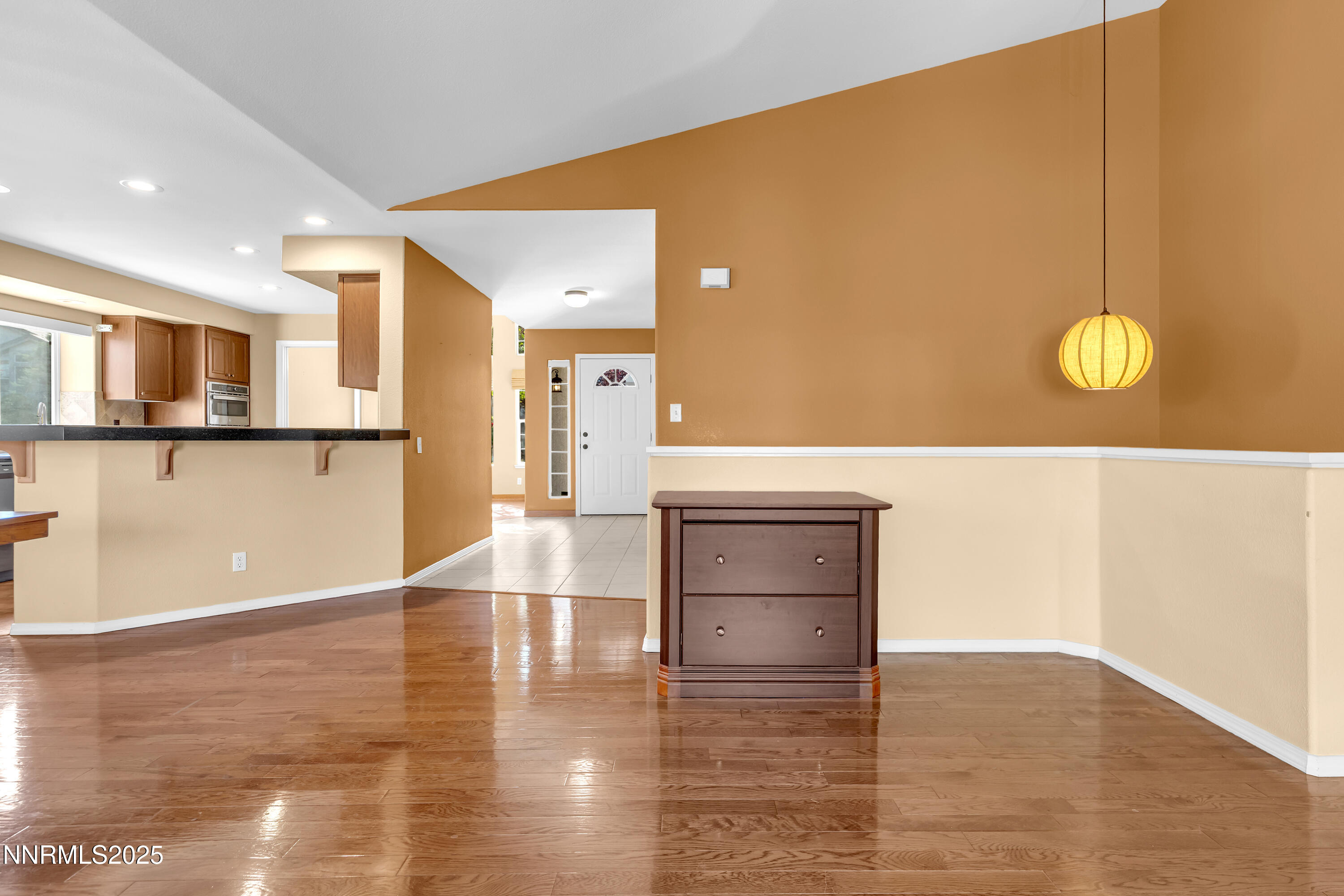 6248 Golden Meadow Road Reno, NV 89519 - Photo 13 of 64 a view of a living room and kitchen with a sink