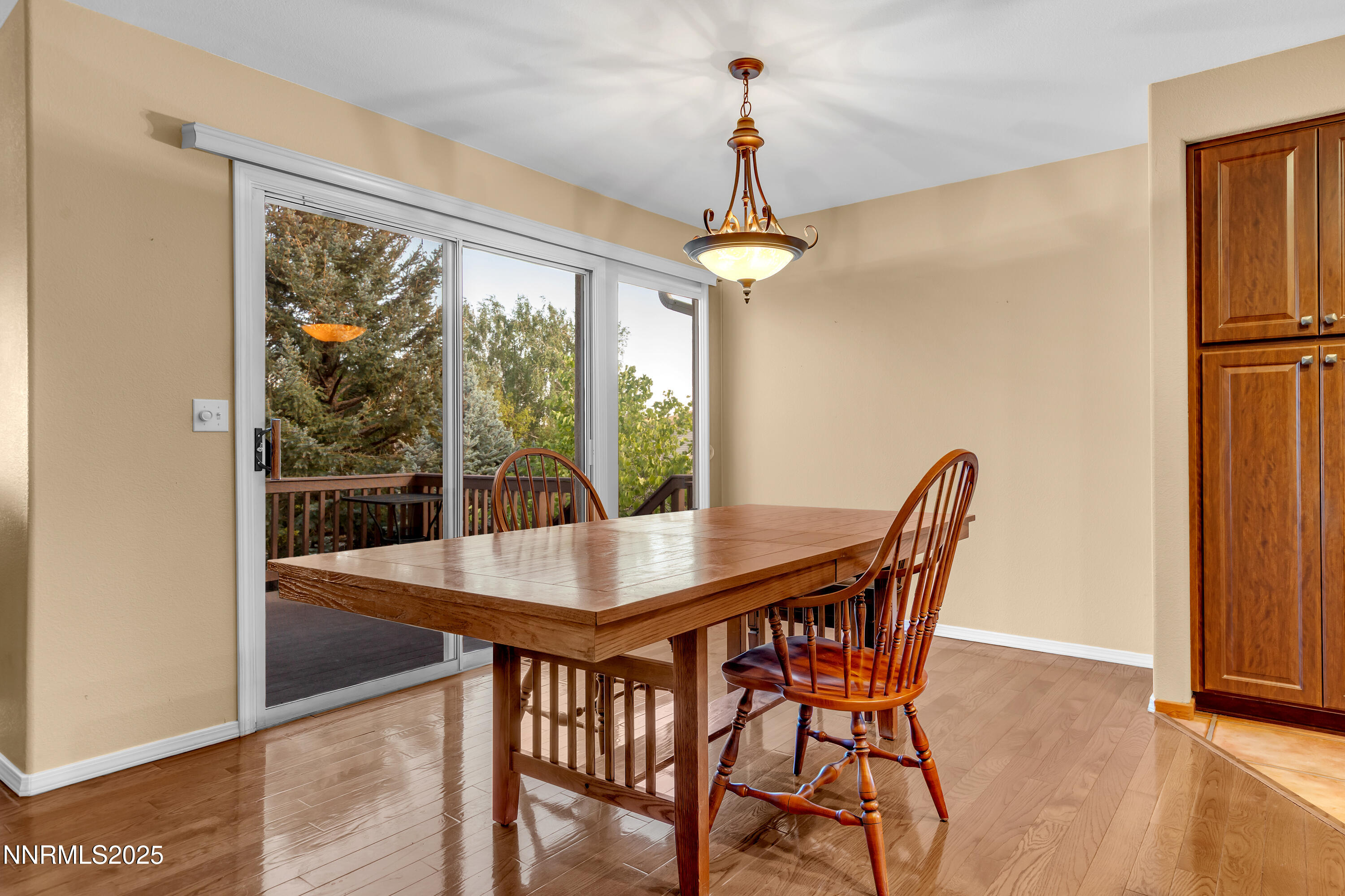 6248 Golden Meadow Road Reno, NV 89519 - Photo 15 of 64 a view of a dining room with furniture window and wooden floor