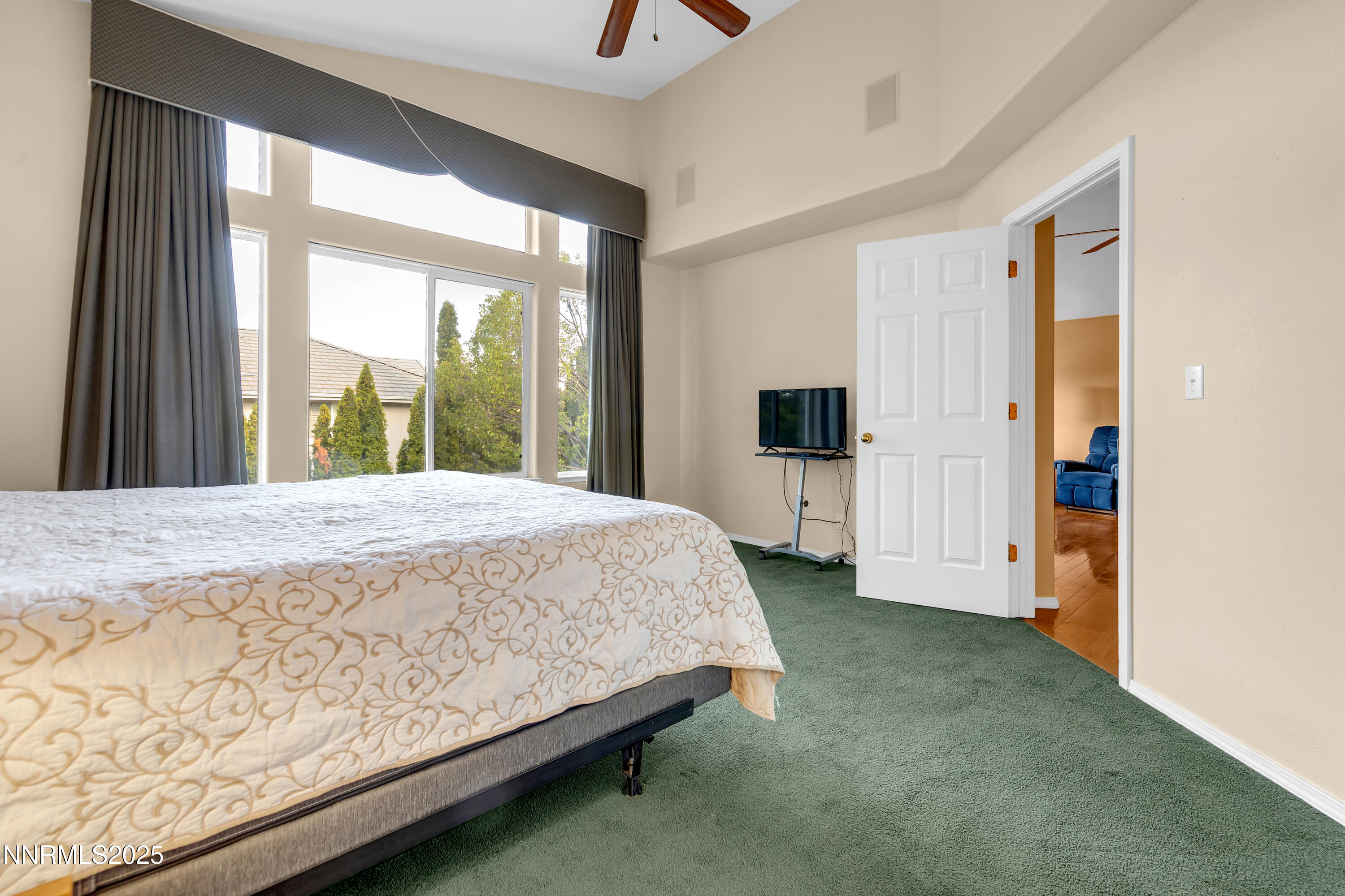 6248 Golden Meadow Road Reno, NV 89519 - Photo 23 of 64 a spacious bedroom with a large bed and a dresser
