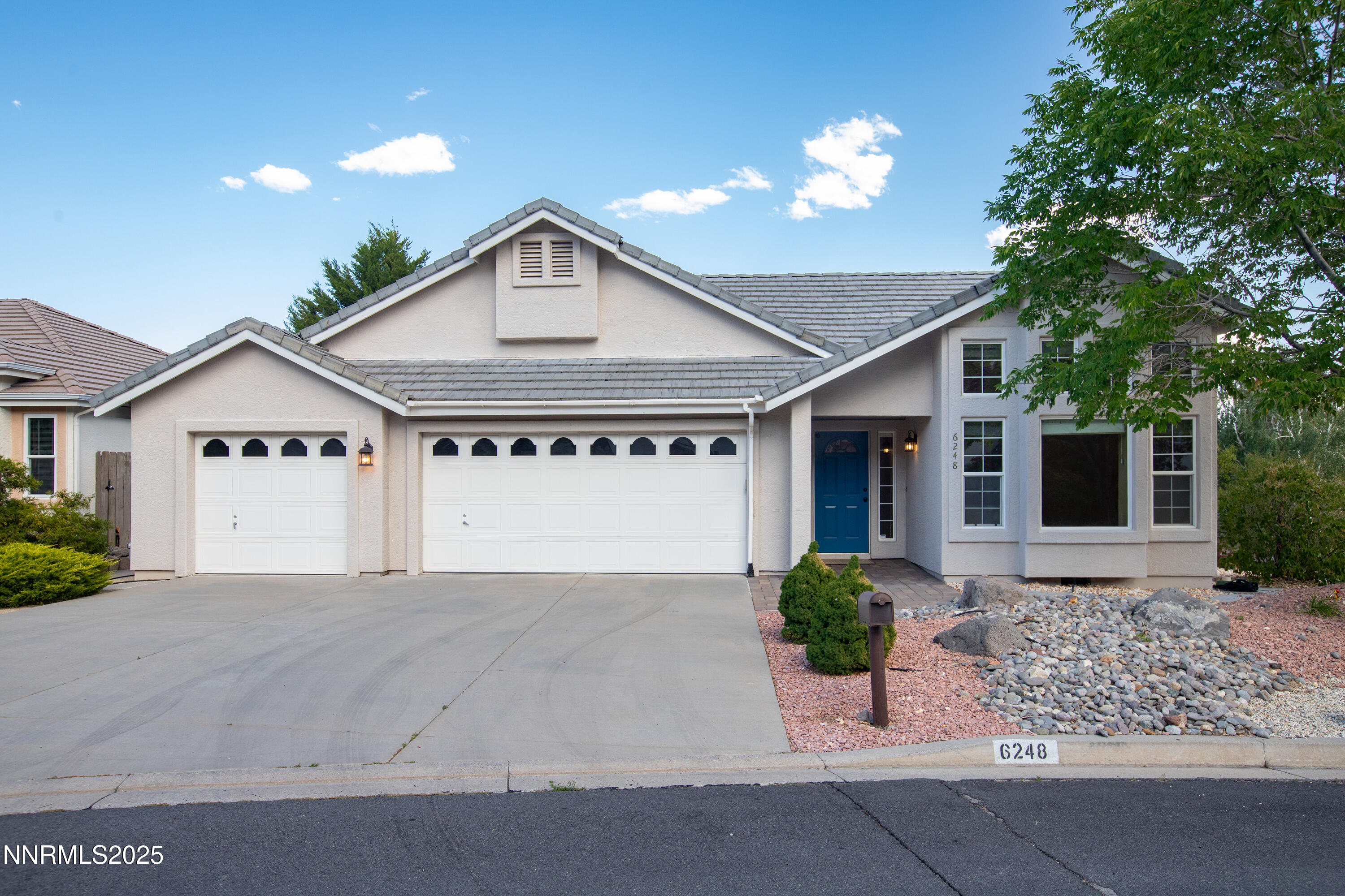6248 Golden Meadow Road Reno, NV 89519 - Photo 3 of 64 a front view of a house with garden