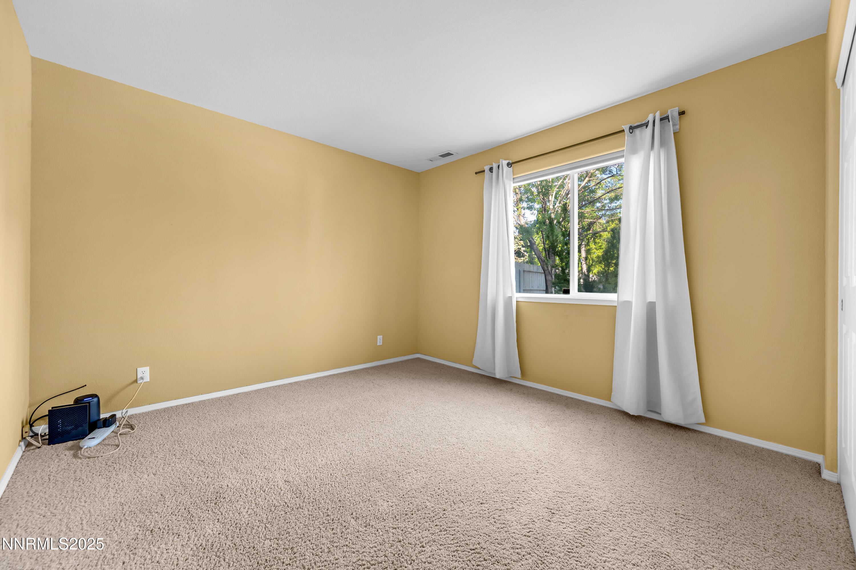 6248 Golden Meadow Road Reno, NV 89519 - Photo 35 of 64 a view of an empty room with a window