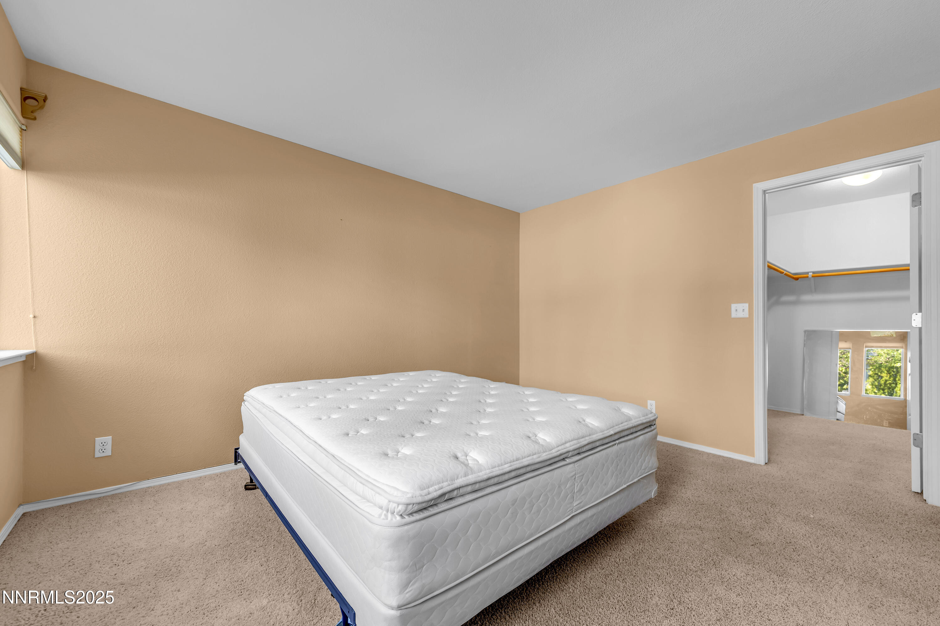 6248 Golden Meadow Road Reno, NV 89519 - Photo 38 of 64 a bed sitting in a spacious bedroom next to a window
