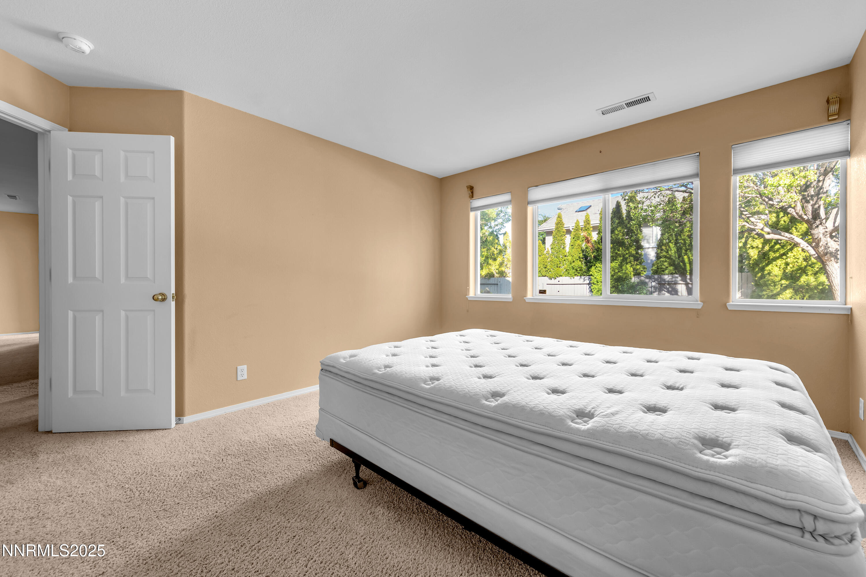 6248 Golden Meadow Road Reno, NV 89519 - Photo 39 of 64 a bedroom with a bed and window