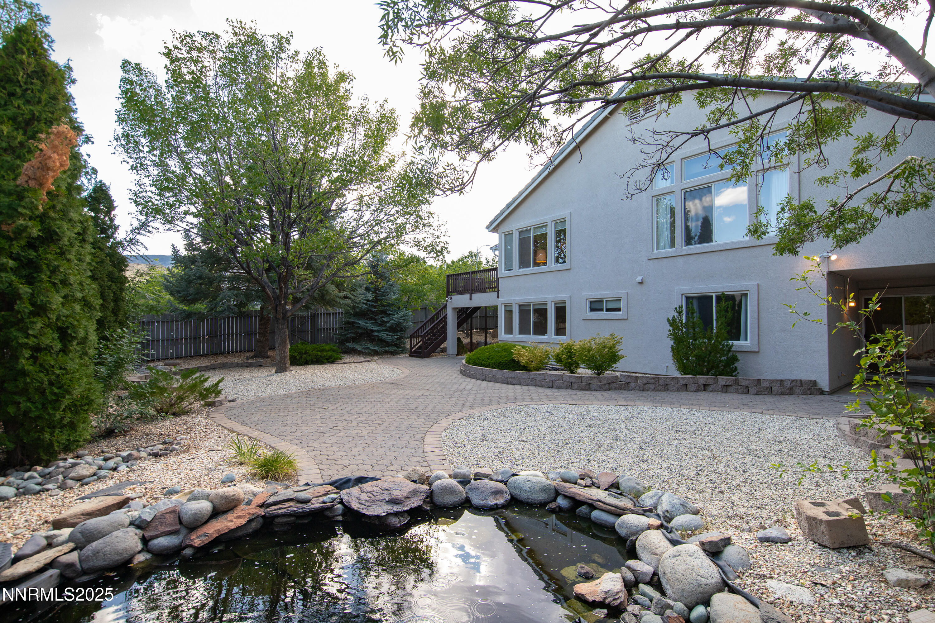 6248 Golden Meadow Road Reno, NV 89519 - Photo 42 of 64 a front view of a house with a yard