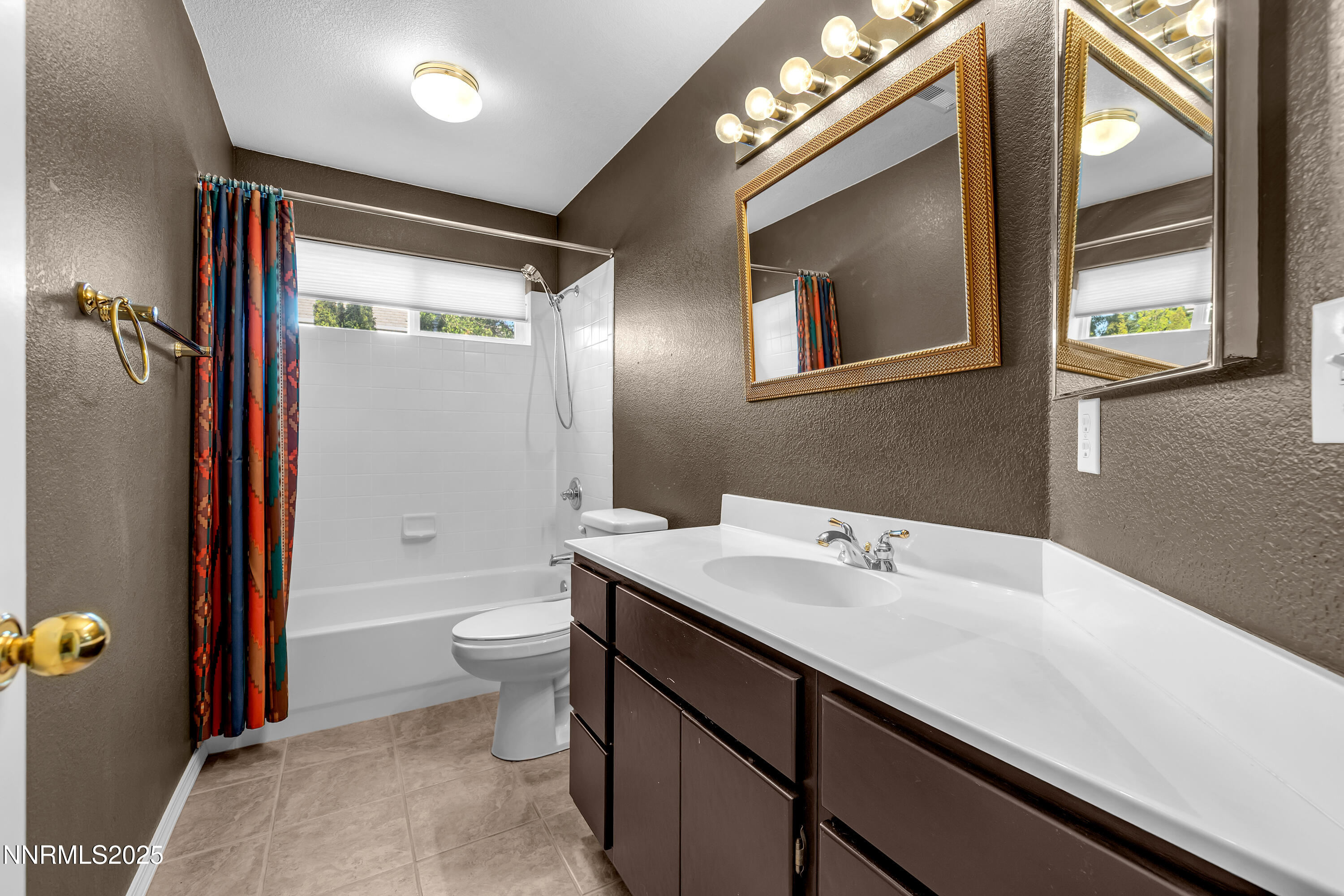 6248 Golden Meadow Road Reno, NV 89519 - Photo 43 of 64 a bathroom with a sink a toilet a large mirror and shower
