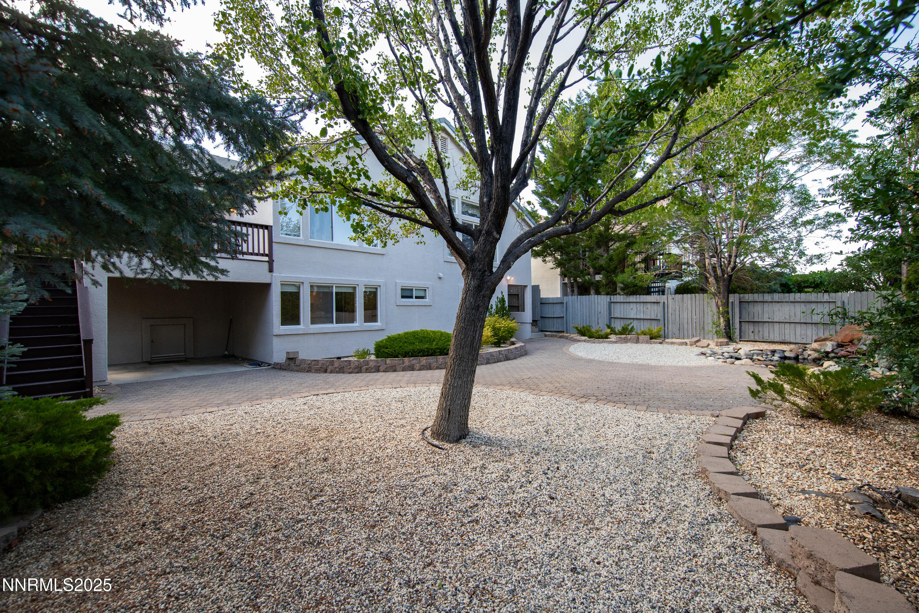 6248 Golden Meadow Road Reno, NV 89519 - Photo 61 of 64 a view of a house with tree next to a road