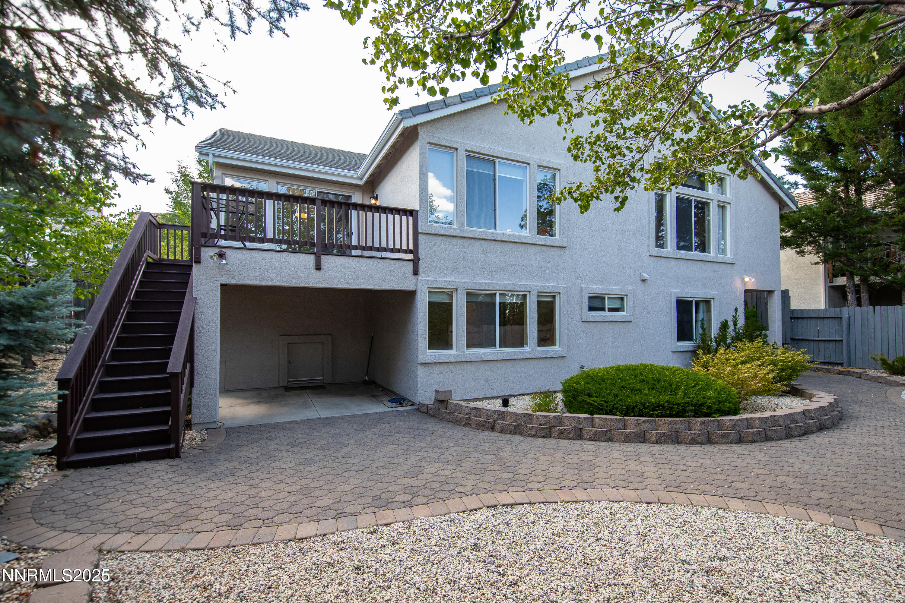 6248 Golden Meadow Road Reno, NV 89519 - Photo 62 of 64 a front view of a house with a garden