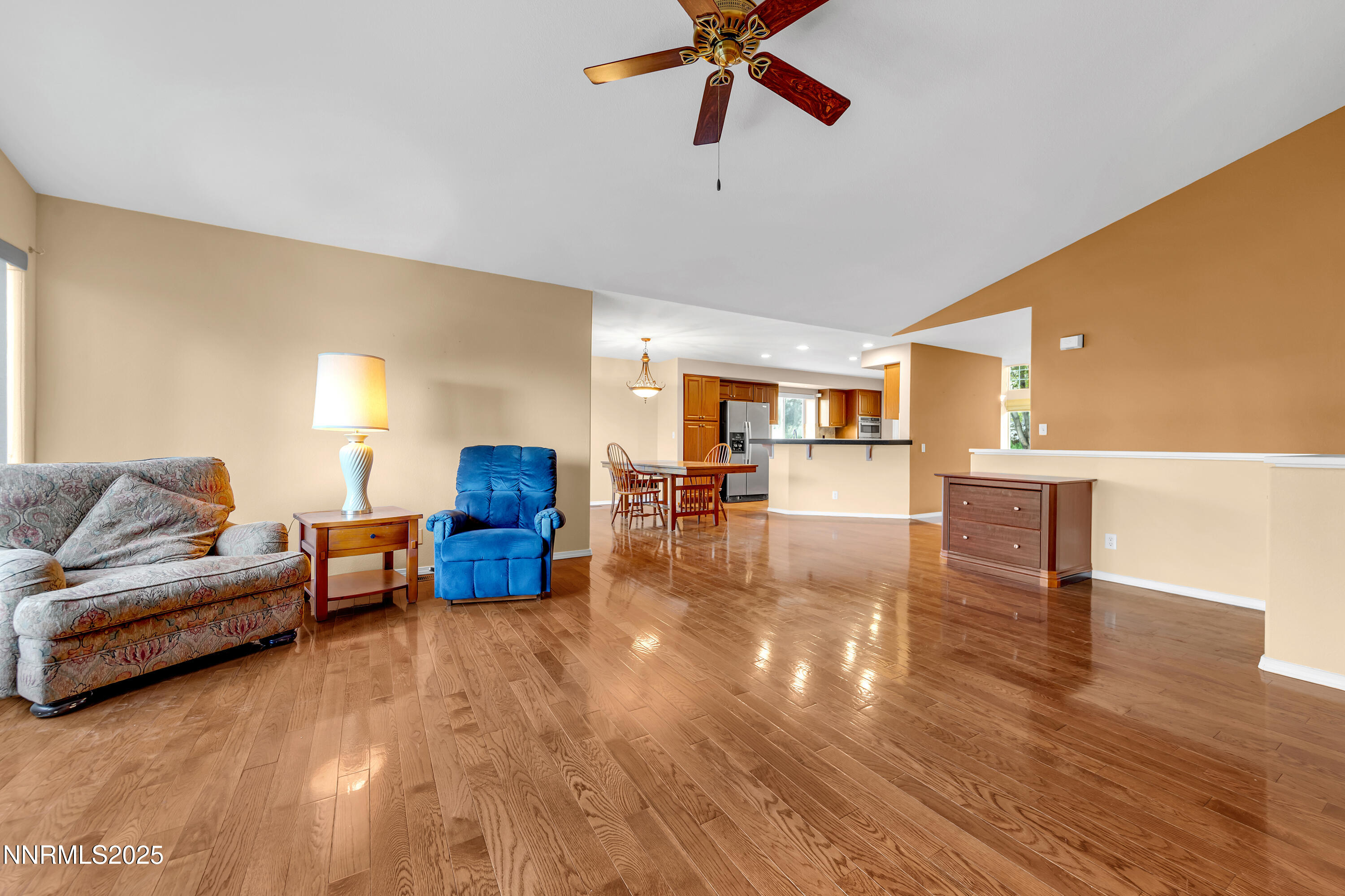 6248 Golden Meadow Road Reno, NV 89519 - Photo 10 of 64 a living room with furniture and a wooden floor