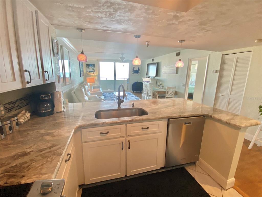 6035 Sea Ranch Drive, Unit 901 Hudson, FL 34667 - Photo 5 of 72 a kitchen with sink cabinets and window