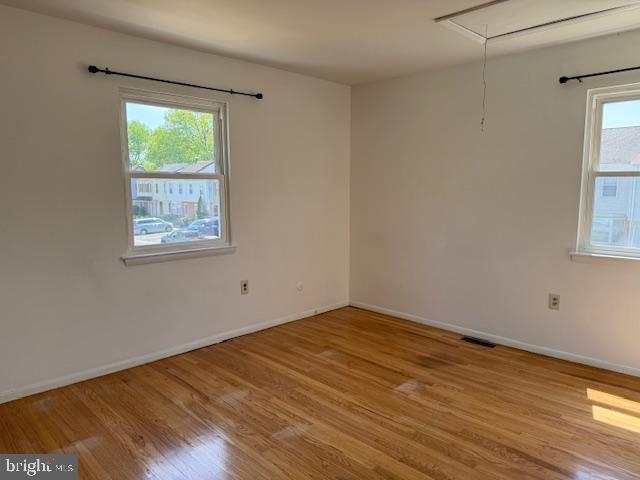 28 Keith Street Newark, DE 19713 - Photo 10 of 20 a view of an empty room with wooden floor and a window