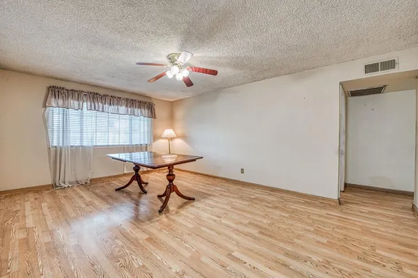 a kitchen that has a lot of cabinets in it and appliances