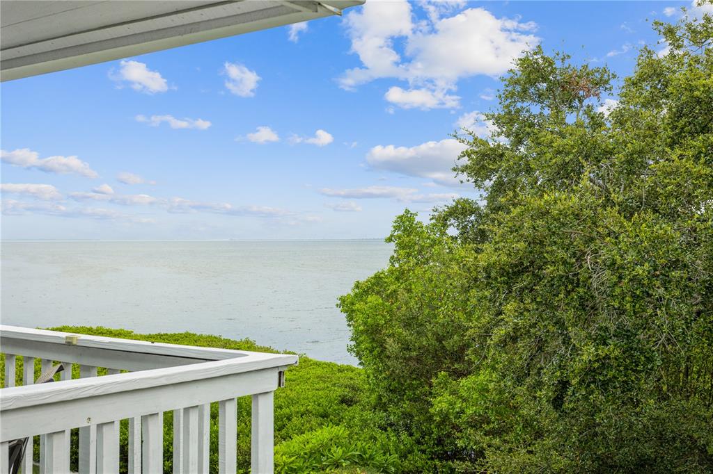 4863 West Flamingo Road, Unit 2 Tampa, FL 33611 - Photo 1 of 1 a view of a balcony with an outdoor space and seating
