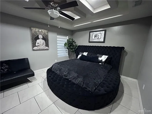 a black leather couch sitting in a room