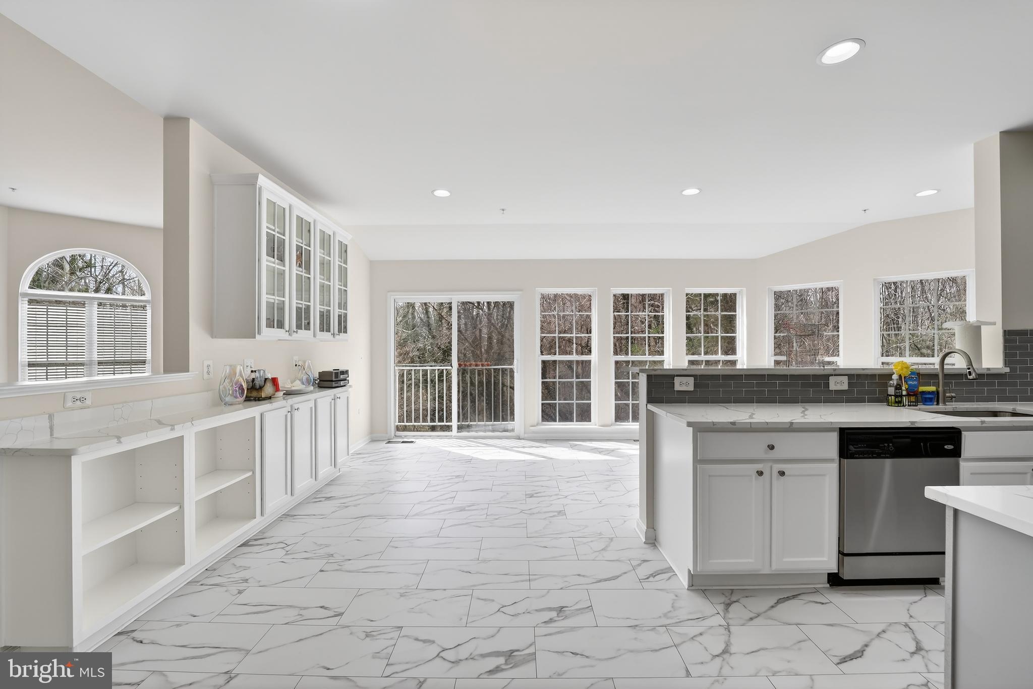 16101 Venice Road Aquasco, MD 20608 - Photo 19 of 60 a large white kitchen with cabinets