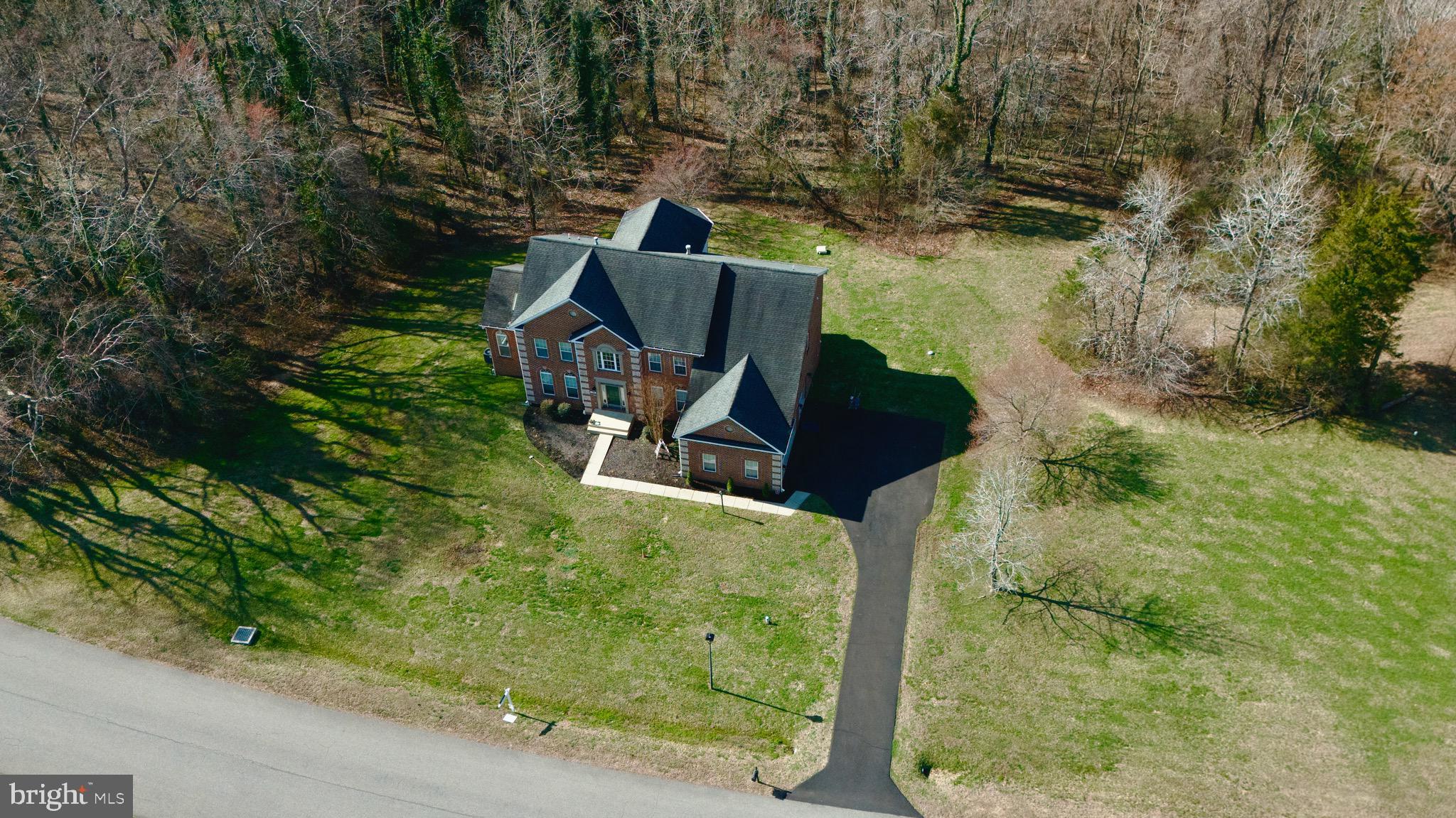 16101 Venice Road Aquasco, MD 20608 - Photo 2 of 60 an aerial view of a house with yard and green space