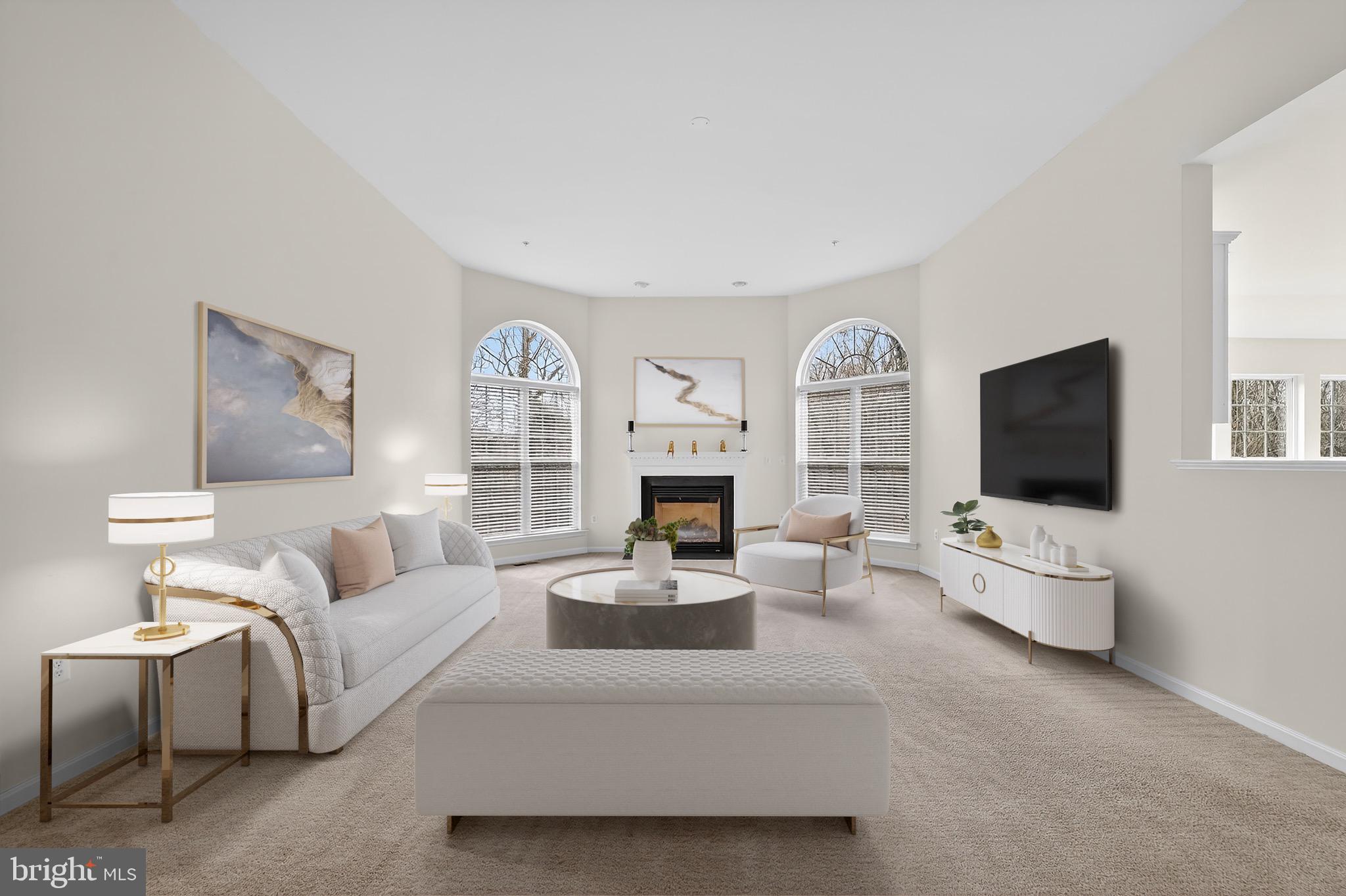 16101 Venice Road Aquasco, MD 20608 - Photo 24 of 60 a living room with furniture a flat screen tv and a fireplace